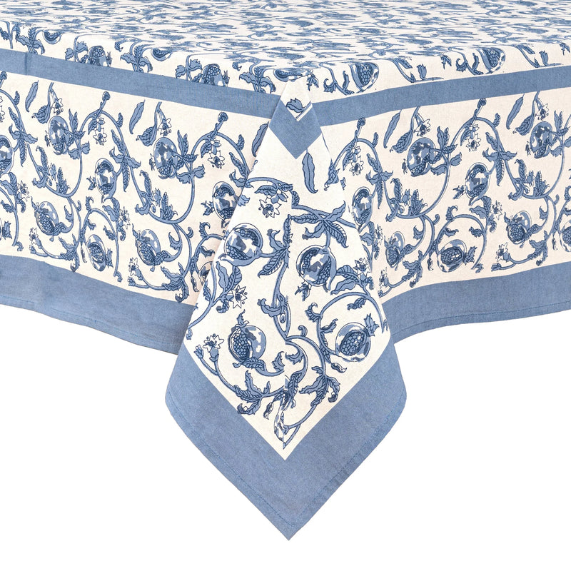 Caravan Home | 59 x 86 Granada Cornflower Blue Tablecloth featuring a hand-printed floral pattern with cornflower blue pomegranates, suitable for various dining occasions.