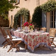 Caravan Home 59 x 86 Red & Grey Tablecloth on an elegantly set outdoor dining table, surrounded by chairs, embodying the Jardin collection's French garden-inspired design.