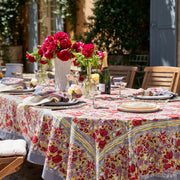 Caravan Home | 59 x 86 Red & Grey Tablecloth on a table, adorned with a floral centerpiece, showcasing artisanal craftsmanship inspired by Southern French gardens.
