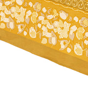 Forest Harvest Grey & Mustard Tablecloth features a hand-printed fruit and foliage design, showcasing Provençal inspiration with artisan craftsmanship, ideal for enhancing dining experiences.