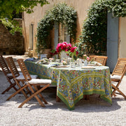 Caravan Home 59 x 86 Jardin Blue & Vert Tablecloth elegantly set on an outdoor dinner table, showcasing artisan craftsmanship inspired by Southern France's lush gardens.