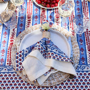Ivory napkins elegantly arranged on a plate, showcasing Caravan Home's 21 x 21 Everyday Napkins Set of 4, ideal for enhancing dining experiences.