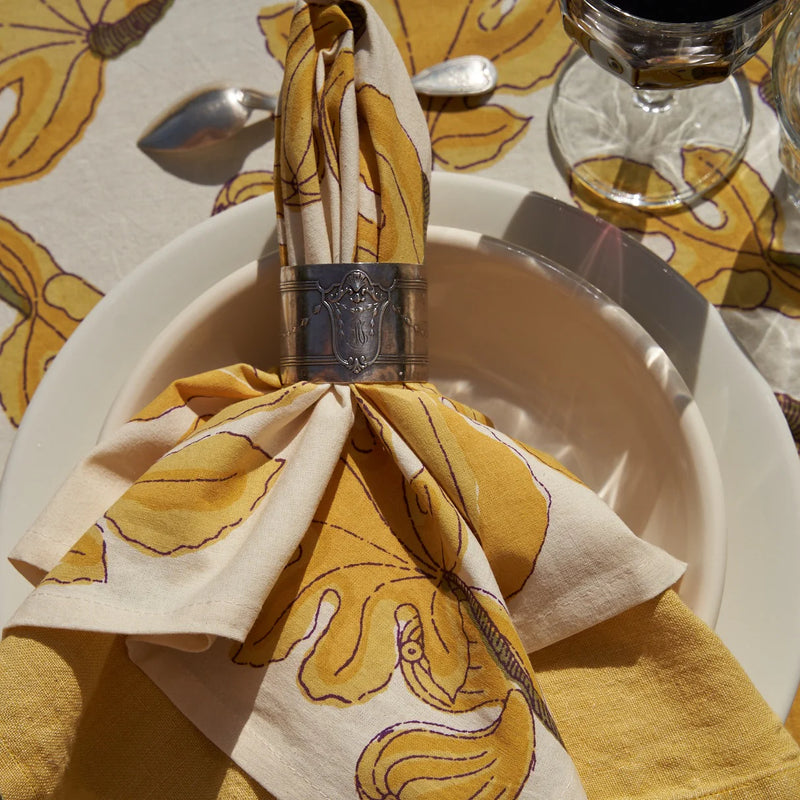 Caravan Home | 19 x 19 Fig Citrine Napkins Set of 6 displayed elegantly on a plate, enhancing table settings for special occasions or everyday dining.