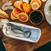 UASHMAMA | Panino Storage Tray - White, a sleek, washable paper tray ideal for organizing jewelry, keys, or snacks, featured among fresh food items.