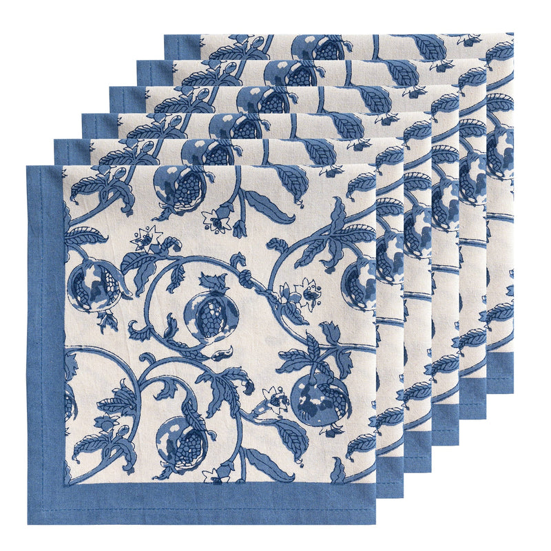 Granada Cornflower Blue Napkins set, featuring blue floral patterns on white, hand-printed for elegance; ideal for enhancing table settings.