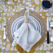 Caravan Home 21 x 21 White Everyday Napkins set of 4 displayed elegantly on a table setting with glasses, showcasing refined craftsmanship and casual luxury.