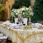 Caravan Home | 21 x 21 White Everyday Napkins Set of 4 displayed on a table with grapes and a floral centerpiece, showcasing luxurious dining elegance.