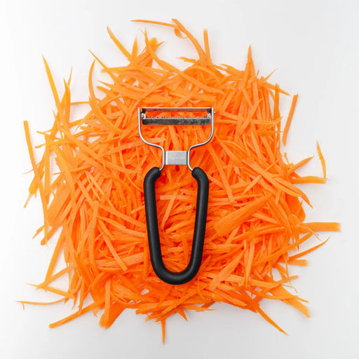Spartan Kitchen | Spartan Shredder (Black) displayed on julienned carrots, showcasing its efficiency and precision, from Athens Cooks' curated kitchen tool selection.