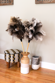 Earth & Nest | Feather Duster in a wooden vase, showcasing premium feathers bound to a blond wood handle with black leather accents, ideal for home cleaning.