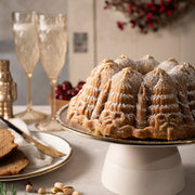 Nordic Ware | Very Merry Bundt® Pan featuring holiday-themed designs, perfect for creating stunning Bundt cakes. Ideal for festive baking with high-quality, nonstick cast aluminum.