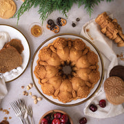 Nordic Ware | Very Merry Bundt® Pan showcasing intricate holiday designs, perfect for creating stunning centerpiece cakes with easy release and even baking.
