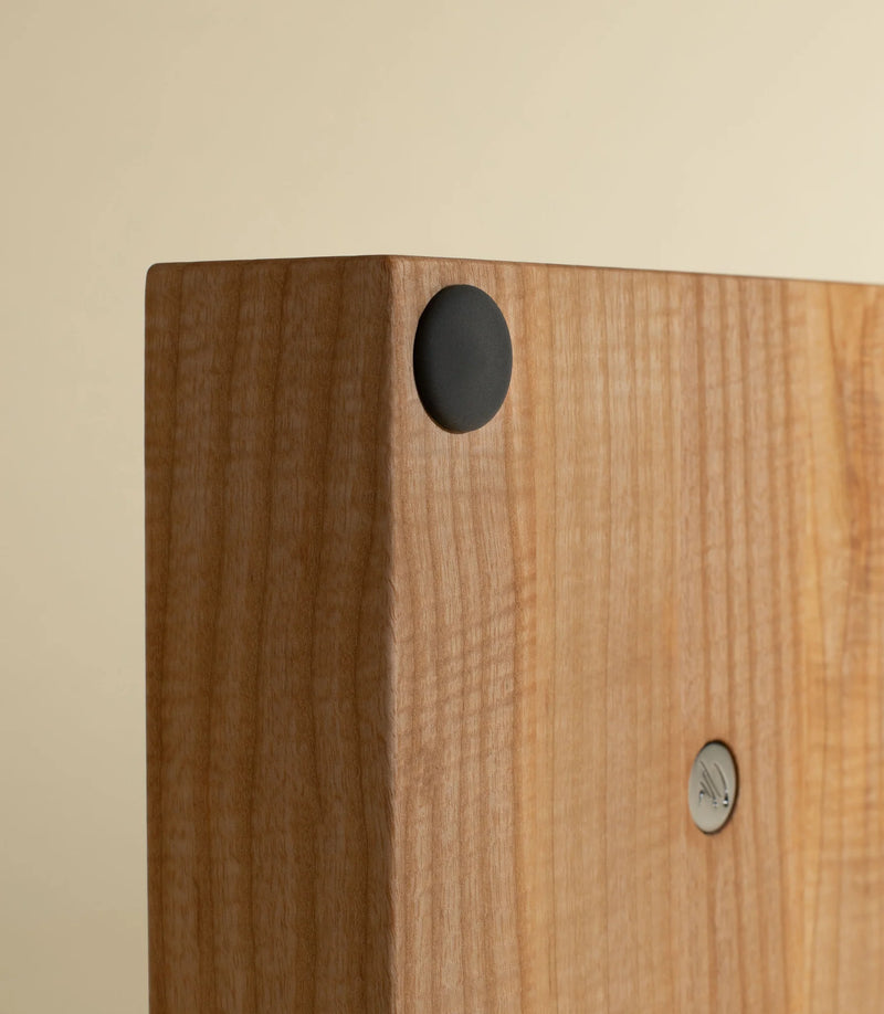 Holcomb Studio Perch Mortar & Pestle on wooden base, showcasing its granite texture and architectural design, ideal for grinding spices.