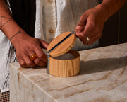 Holcomb Studio | Stash Salt Cellar being opened with a knife, showcasing its wooden design and lid, emphasizing artisan craftsmanship.