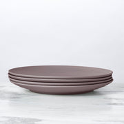 Stacked Fable New York Bamboo Plates from the illustrated collection, showcasing durable, eco-friendly dinnerware crafted from organic bamboo fiber, emphasizing sustainability and style.