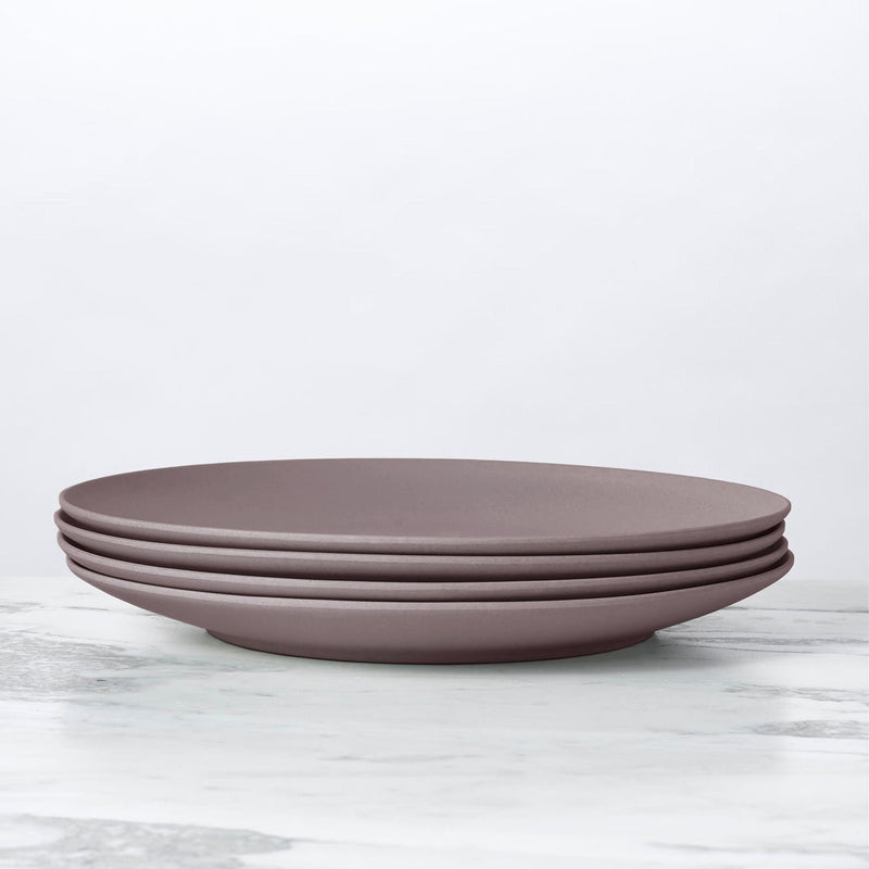 Stacked Fable New York Bamboo Plates from the illustrated collection, showcasing durable, eco-friendly dinnerware crafted from organic bamboo fiber, emphasizing sustainability and style.