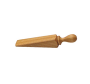 Earth & Nest | Small Door Wedge, a single-piece oiled hardwood with a pointed tip, ideal for kitchen use. Made in England.