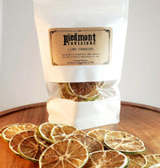 Piedmont Provisions | Dried Fruit Cocktail Garnishes - Lime, featuring close-up views of dehydrated lemon and orange slices, ideal for enhancing beverages with citrus elegance.