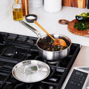 Heritage Steel | Titanium Series Mini Sauté with Lid on a stove, showcasing its premium durability and versatility for cooking.