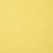 Caravan Home | 21 x 21 Citrus Everyday Napkin Set of 4, featuring yellow linen with subtle patterns, hand-dyed, pre-washed, and tailored with mitered corners.