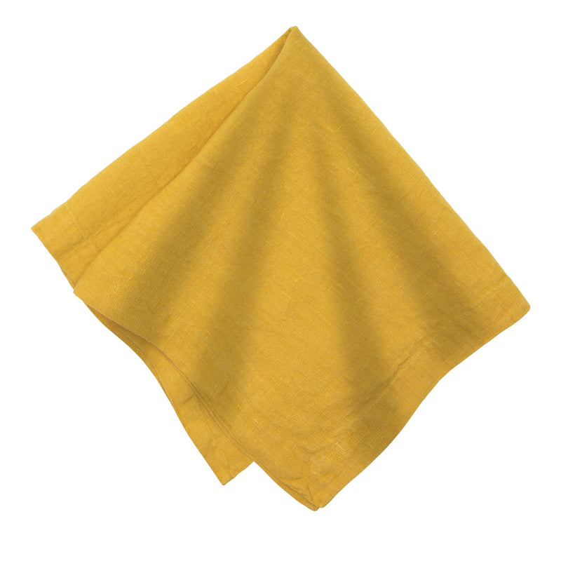 Caravan Home | 21 x 21 Dijon Everyday Napkins Set of 4, featuring a yellow, oversized, hand-dyed linen napkin, folded neatly, showcasing craftsmanship.