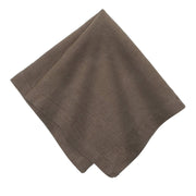Caravan Home | 21 x 21 Walnut Everyday Napkins Set of 4, oversized, hand-dyed linen napkins folded neatly, showcasing refined craftsmanship and mitered corners for a luxurious dining experience.