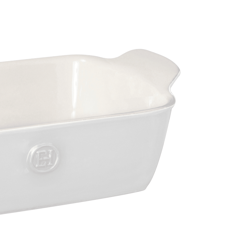 Emile Henry | Modern Classics Loaf Pan in white ceramic with integrated handles, ideal for baking bread and cakes, showcased at a slight angle.
