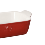 Emile Henry | Modern Classics Loaf Pan, Rouge, 9 x 5, featuring a red enameled exterior, white interior, and small handles, perfect for versatile baking and serving.