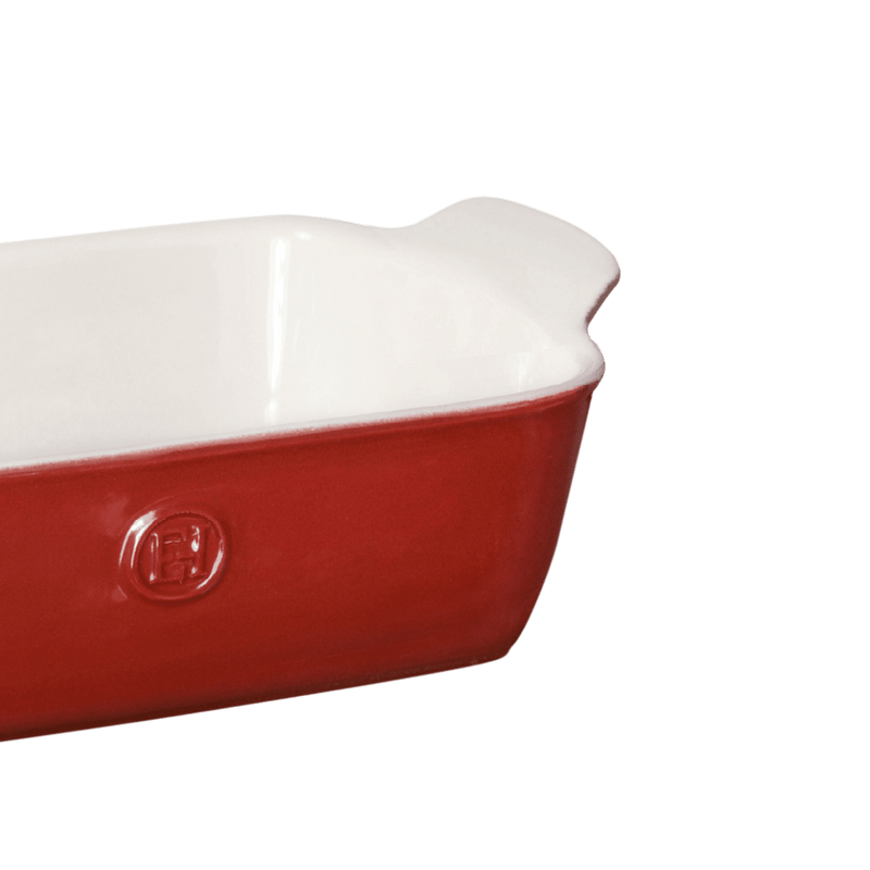 Emile Henry | Modern Classics Loaf Pan, Rouge, 9 x 5, featuring a red enameled exterior, white interior, and small handles, perfect for versatile baking and serving.