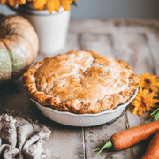 Emile Henry | 175th Anniversary Pie Dish, Green/Ivory, showcasing rustic charm with autumnal accents, embodies French craftsmanship in a cozy, harvest-inspired kitchen setting.