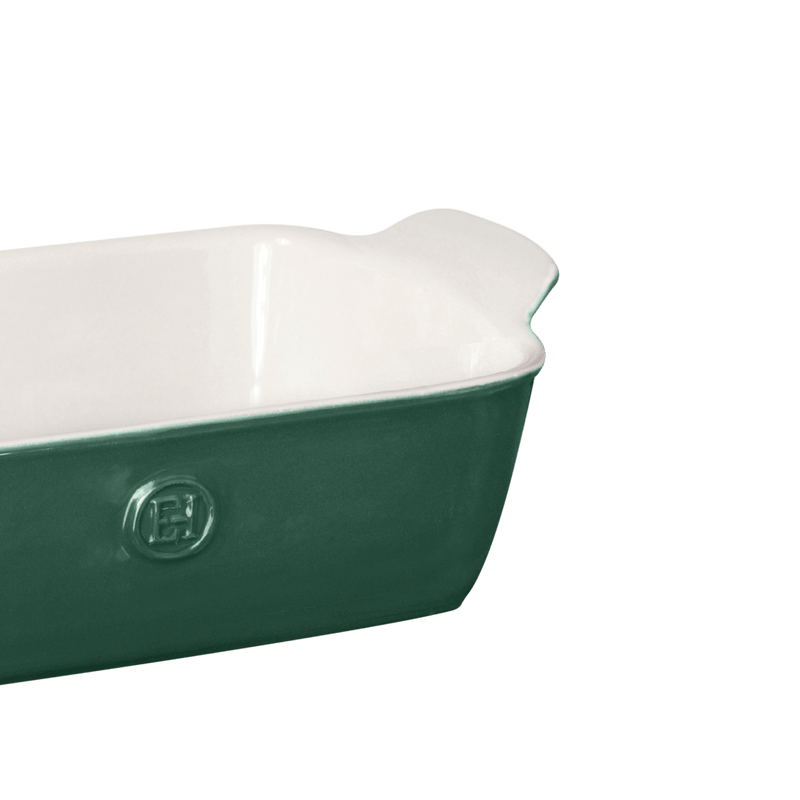 Emile Henry Modern Classics Loaf Pan, Rouge, 9 x 5, featuring a forest-green exterior, white interior, molded handle, and embossed EH logo for stylish baking.