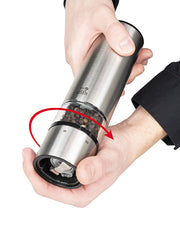 Peugeot | Elis Sense Pepper Mill Stainless Acrylic, 8 Inches, shown with a hand adjusting the grind using the innovative touch-activated and LED-guided control system.