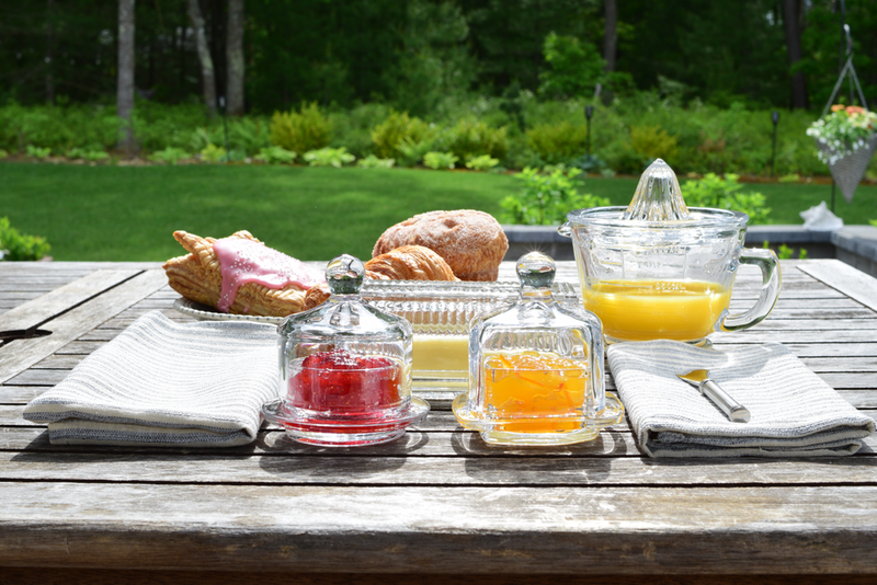 Earth & Nest | Round Cloche Condiment Dish showcasing jams and orange juice on a table, perfect for enhancing your kitchen or party presentation.