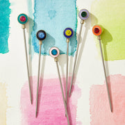 Joanna Buchanan | Cocktail Picks - Enamel Gem: Close-up of a vibrant enamel gem-topped cocktail pick, perfect for elegant drink garnishing.