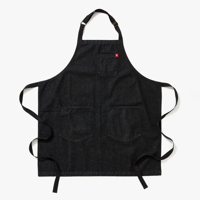 Hedley & Bennett's Essential Apron in Abalone Black Denim, featuring adjustable straps and multiple pockets, ideal for both casual and sophisticated cooking endeavors.
