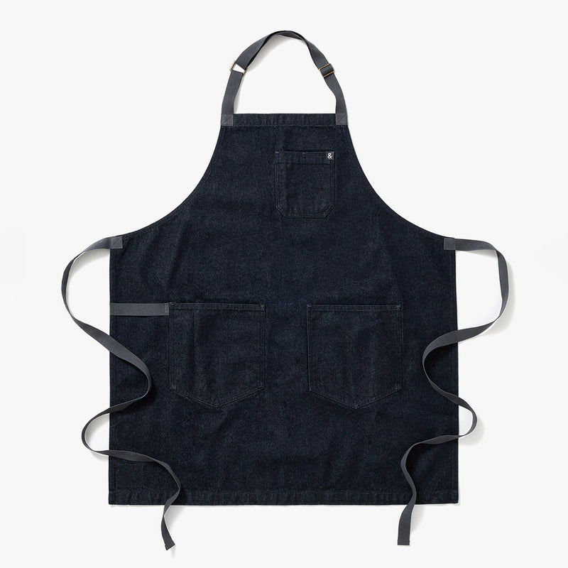 Hedley & Bennett | Essential Aprons - Jack Navy Denim features durable cotton canvas, adjustable neck strap, and multiple pockets for versatile cooking in style.