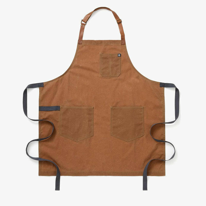 Hedley & Bennett | Essential Waxed Canvas Aprons - Montana: Durable apron with adjustable leather neck strap, navy waist tie, utility loop, perfect for robust cooking and DIY tasks.