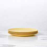 Fable New York's Bamboo Salad Plates, set of 4, elegantly stacked; durable, eco-friendly, perfect for side salads.