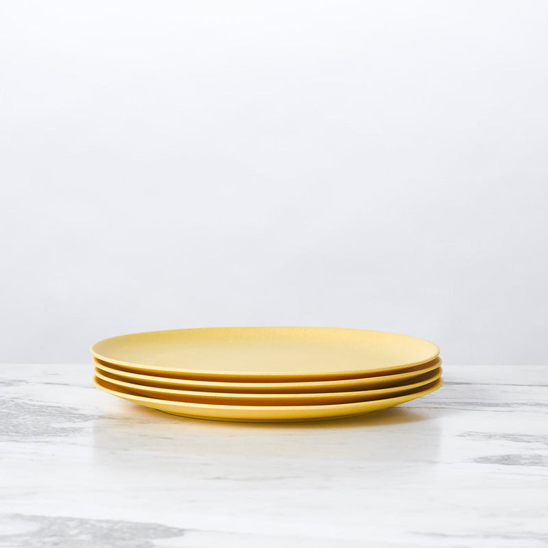 Fable New York's Bamboo Salad Plates, set of 4, elegantly stacked; durable, eco-friendly, perfect for side salads.
