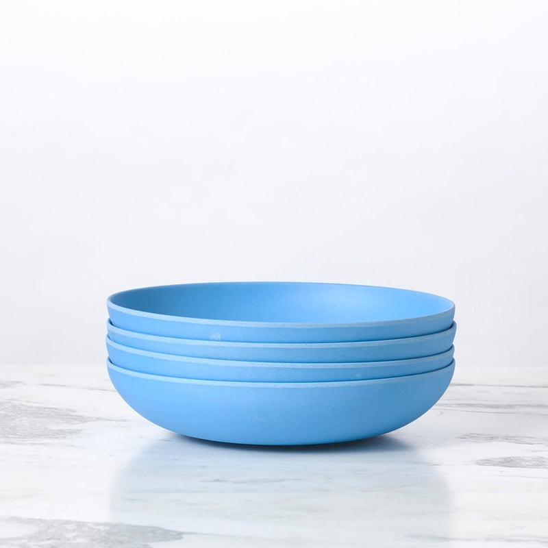 Fable New York | Bamboo Plates & Dinnerware - Low Bowl (Set of 4) - Robins Egg, featuring a stack of eco-friendly blue bowls from the illustrated collection.