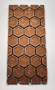 Natural Wood and Beeswax Fire Starters, close-up showing hexagonal shapes, ideal for grills or fireplaces. Made from 100% natural materials, sustainably sourced in the USA.