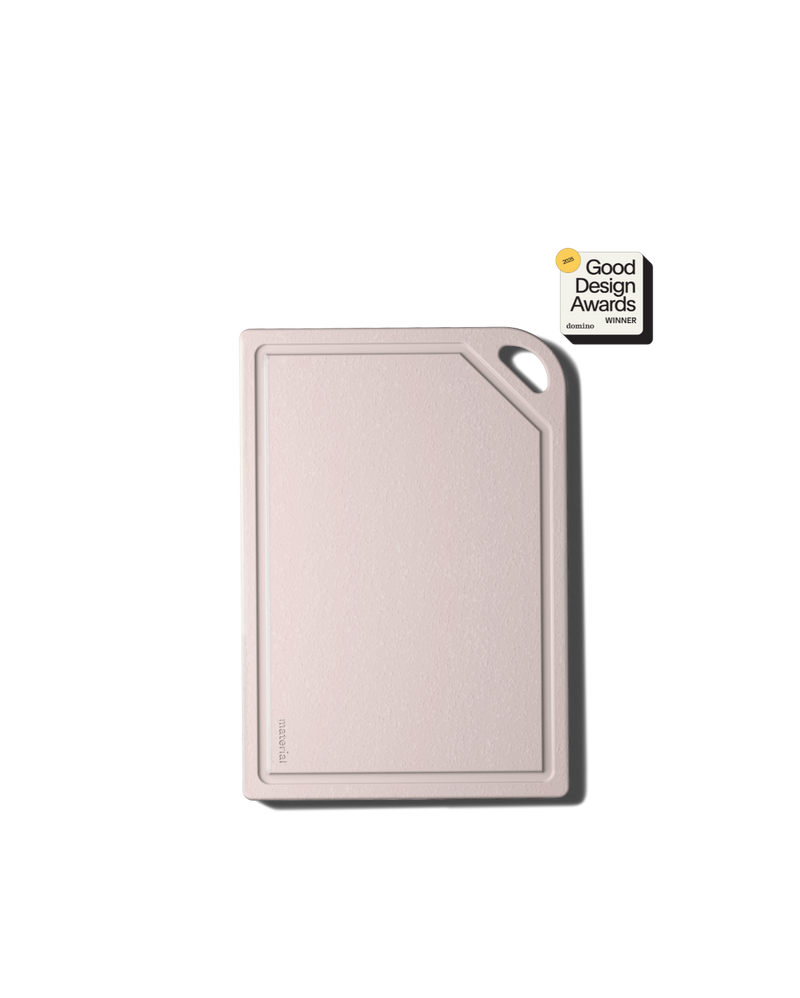 Minimalist MK Free Board™️, Shell, with textured surface and chamfered corner. Features oval handle cut-out, embossed “materia,” and “2023 Good Design Awards Winner” badge.