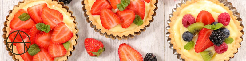 Mother's Day Fruit Tarts topped with strawberries, raspberries, and blueberries, elegantly arranged with cream, showcasing a delightful dessert from Athens Cooks.