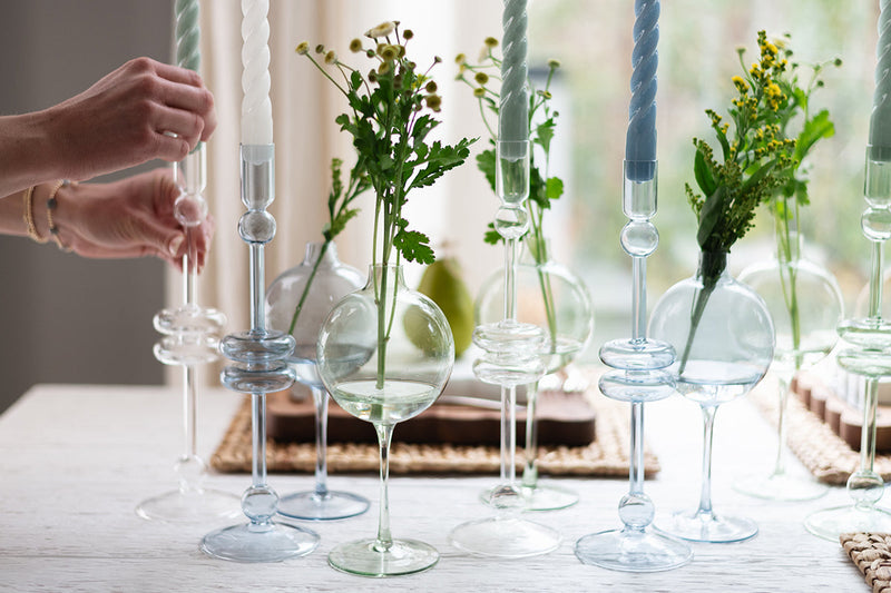 Clear Glass Large Pair Candlestick by Etú HOME, elegantly showcasing flowers in a vase, perfect for elevating home decor with timeless charm.