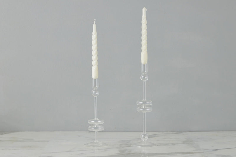 Clear Glass Large Pair Candlestick on marble table, showcasing elegant design for home decor, part of Athens Cooks' curated kitchen and dining collection.
