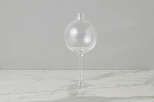 Etú Home | Clear Wine Glass Vase Medium: A unique vase featuring a glass sphere atop a wine glass stem, perfect for elegant table centerpieces and special occasions.