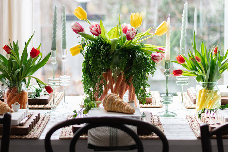 French Bee Mason Jar Small on a table with flowers and candles, showcasing its elegant, organic shape and vintage-inspired French bee seal.
