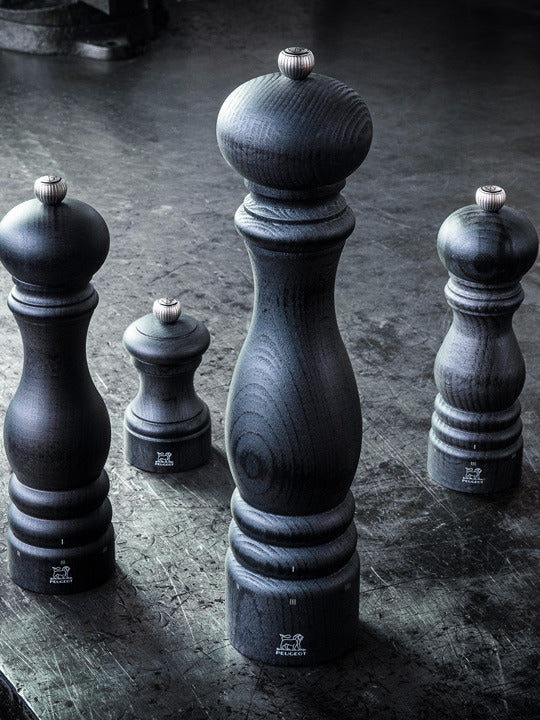 Peugeot | Paris u'Select Wooden Pepper Mill, 12 inches, displayed on a metal surface, showcasing its sleek design and high-precision grind adjustment feature.