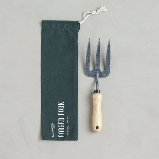 Japanese Hori Hori garden tool with a serrated and smooth stainless steel blade, essential for versatile gardening tasks. Handcrafted in Japan, showcased by Athens Cooks.