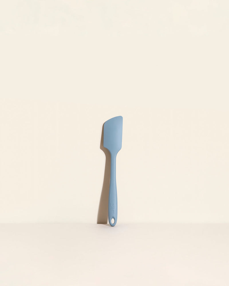 GIR | Skinny Spatula - Slate, an antimicrobial, durable kitchen tool on a white surface, ideal for home cooks and chefs, available at Athens Cooks.