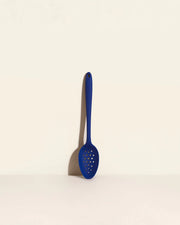 GIR Perforated Spoon: Navy, featuring a branching hole pattern for efficient straining, displayed on a white surface, ideal for cooking and serving.